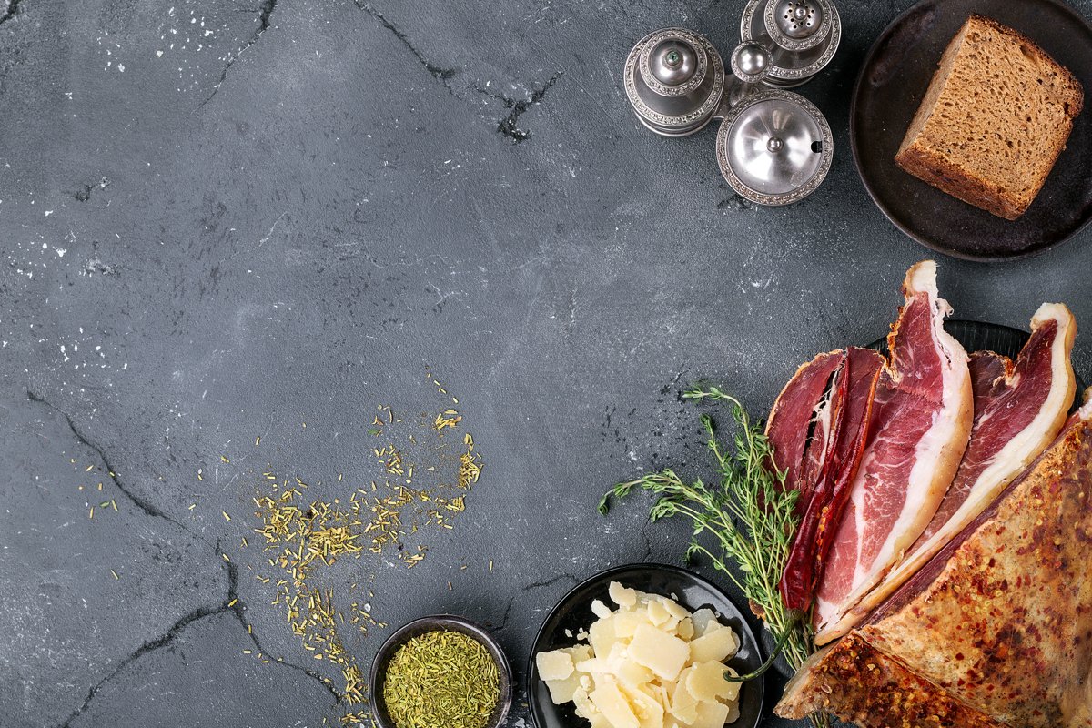 Prosciutto Ham served on a rustic wooden board example image 1