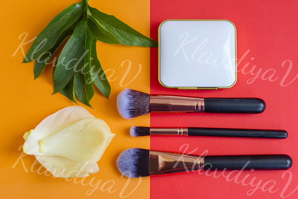 premium makeup brushes and blush on a colored background example image 1