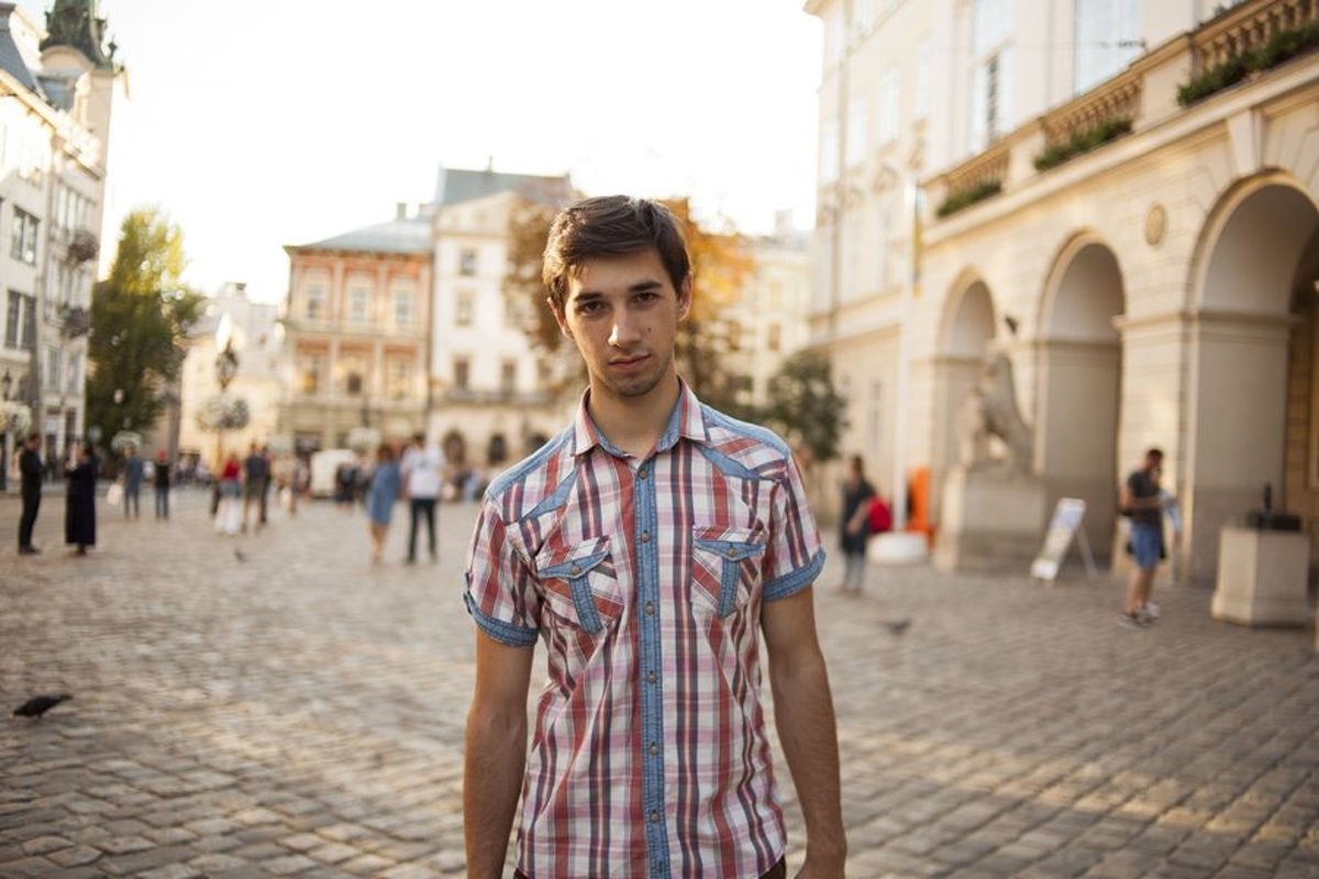 Young man walks in the city example image 1
