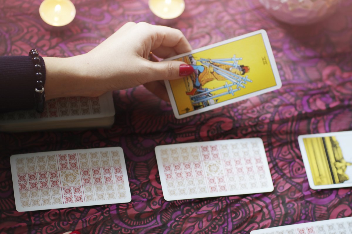 Defocused mystic ritual with tarot cards example image 1