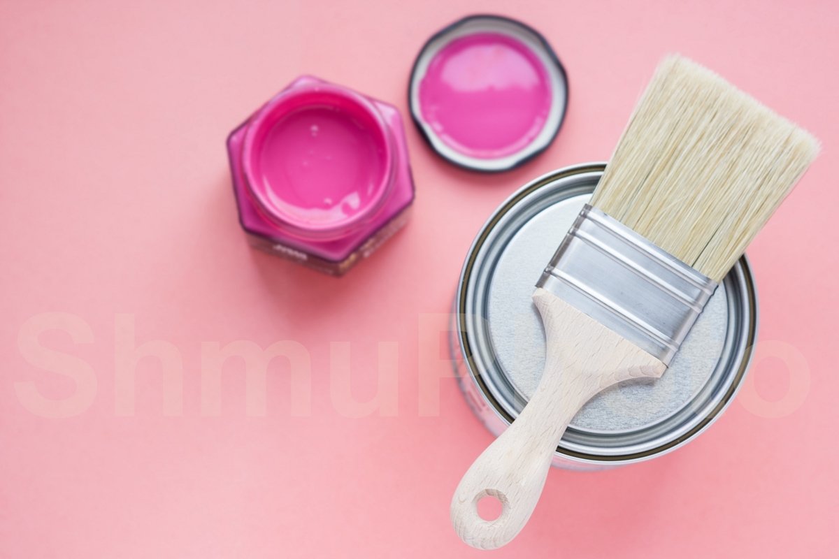 Paint can with purple paint and new brush on pink background example image 1