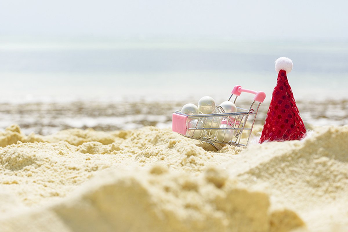 cart with Christmas balls and Santa's hat example image 1