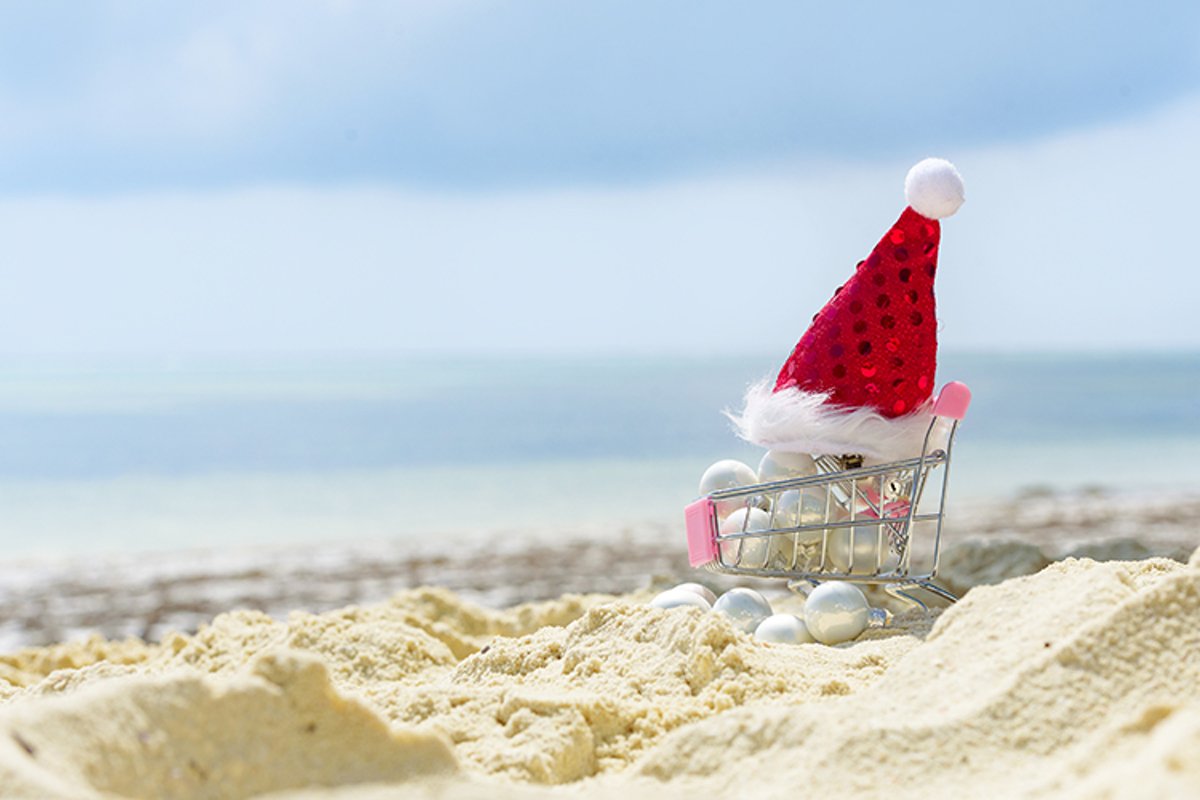 cart with Christmas balls and Santa's hat example image 1
