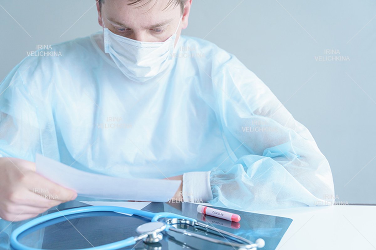 Doctor, patient in medical disposable hat, robe. Face mask example image 1