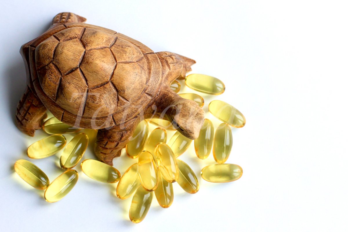 Omega 3 capsules lying on white background example image 1