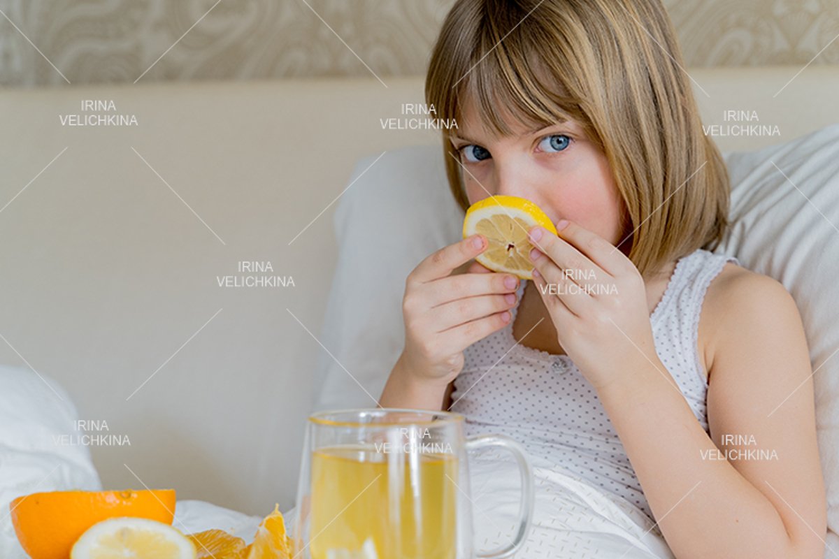 Sick girl in bed. Cup of flu drugs. Tea, orange,lemon,ginger example image 1