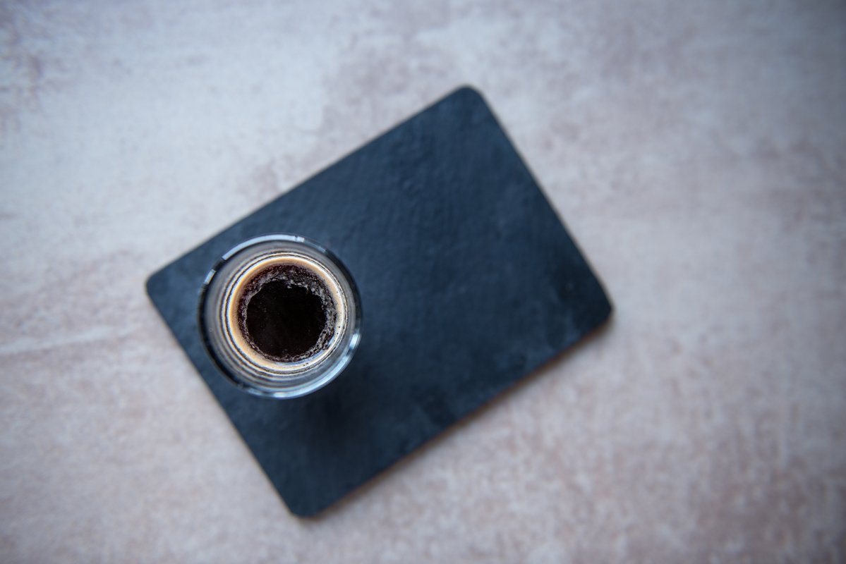 Top view on glass cup of espresso on black board example image 1