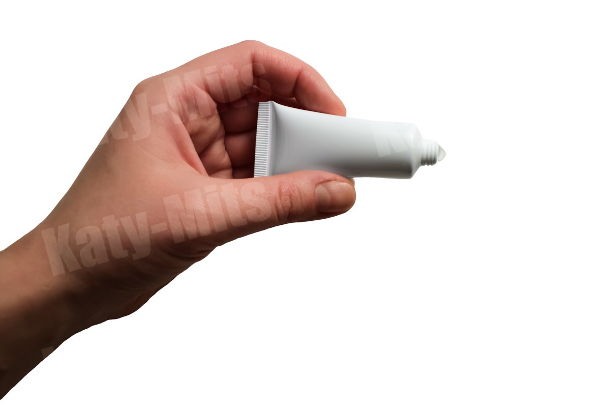 No logo tube of cream or gel holding and squeezing in hand example image 1