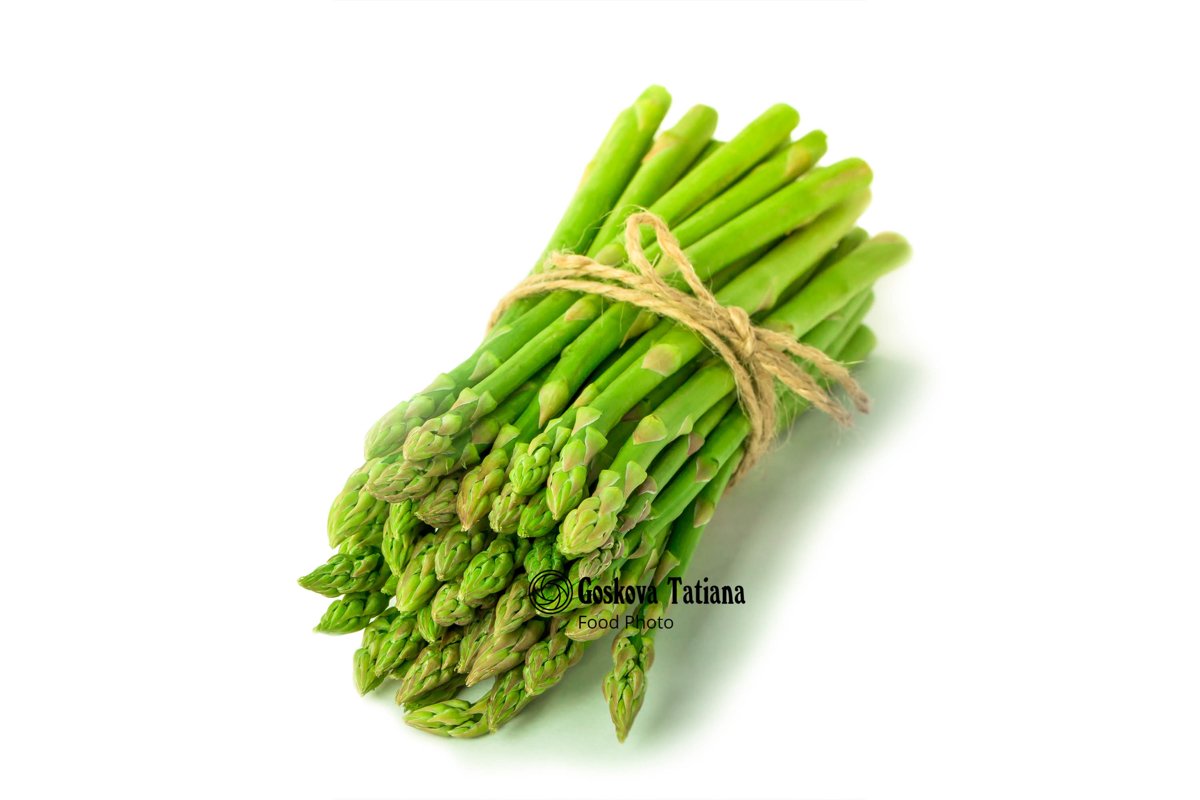 Photo of fresh asparagus isolated on white background example image 1
