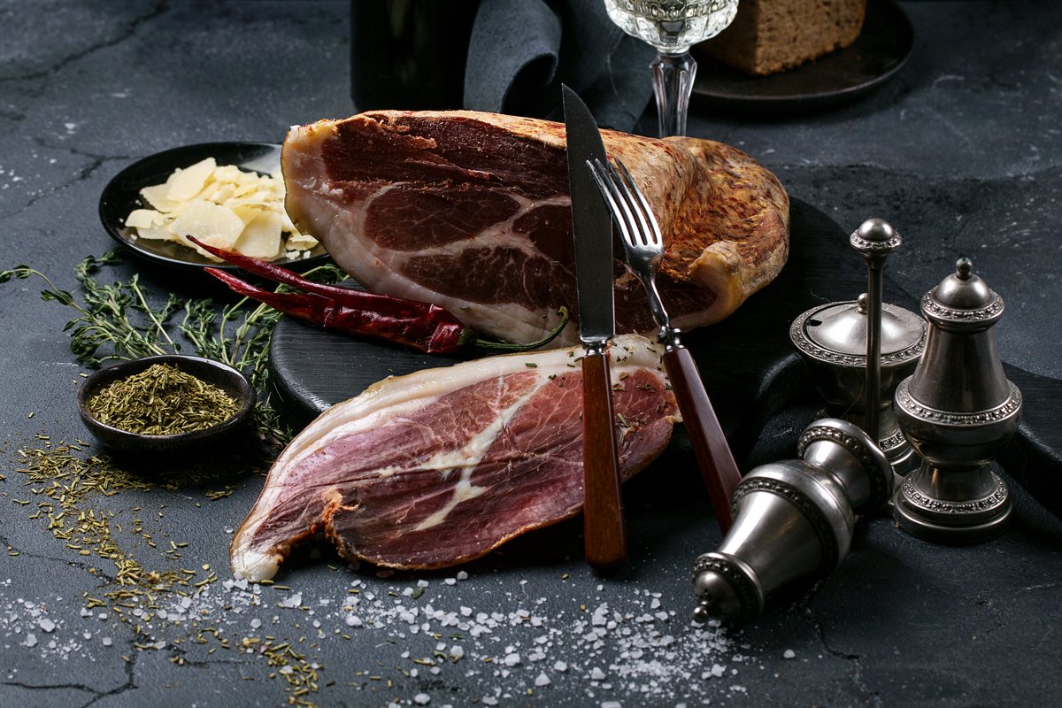 Prosciutto Ham served on a rustic wooden board example image 1