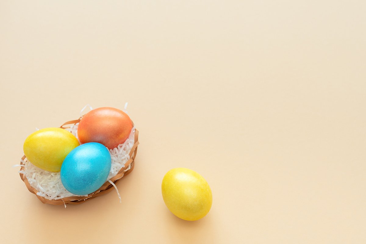Decorated Easter eggs lie in the basket like a nest example image 1