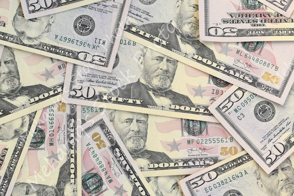 Many american dollar bills close up example image 1