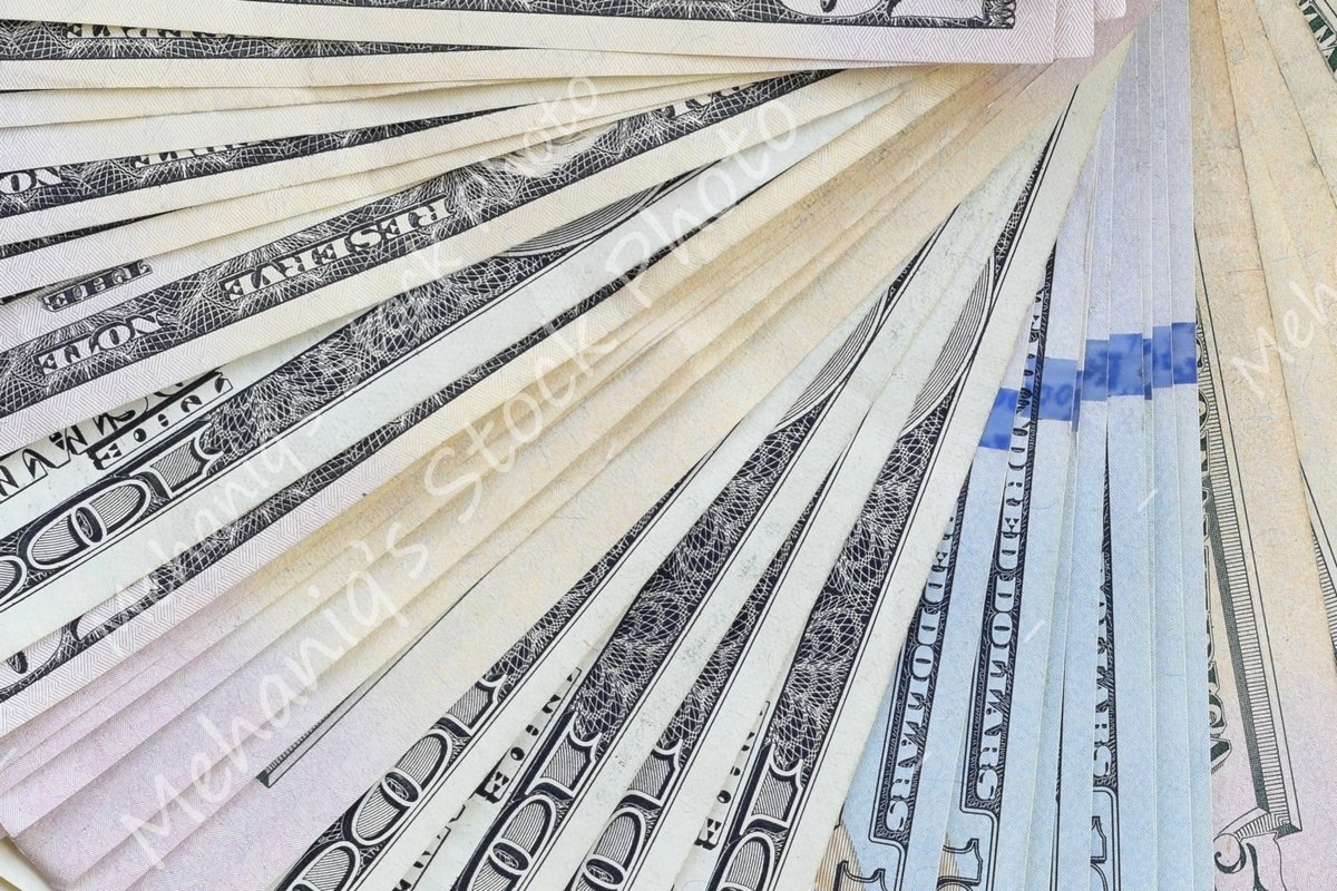 Many american dollar bills close up example image 1