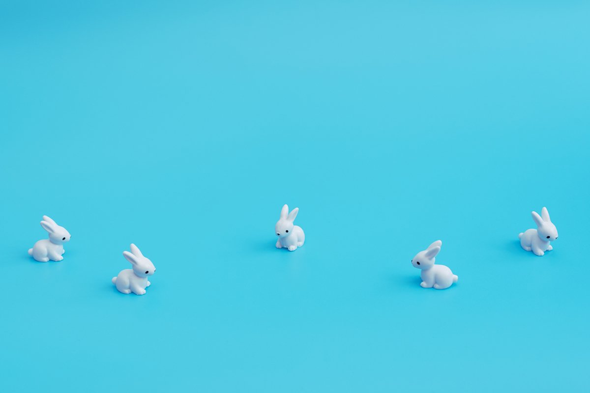 A lot of small white rabbits on blue background. example image 1