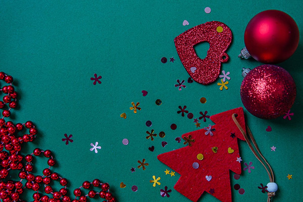 Red Christmas tree, beads, balls on a green background. example image 1