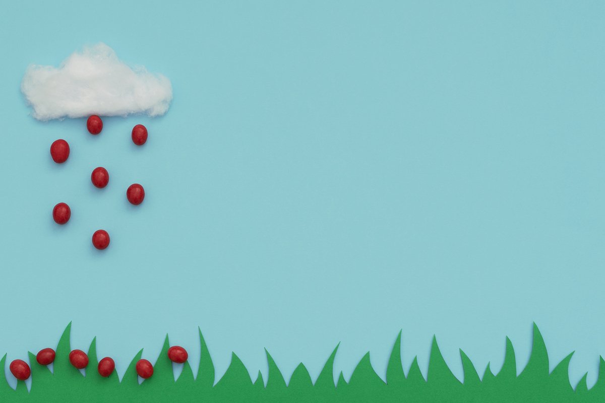 White cotton cloud and the rain of small red Easter eggs example image 1