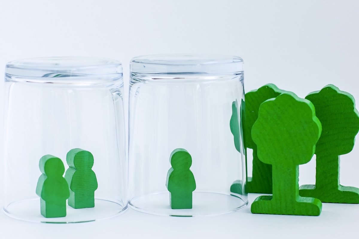 Toy wooden people under a glass. example image 1