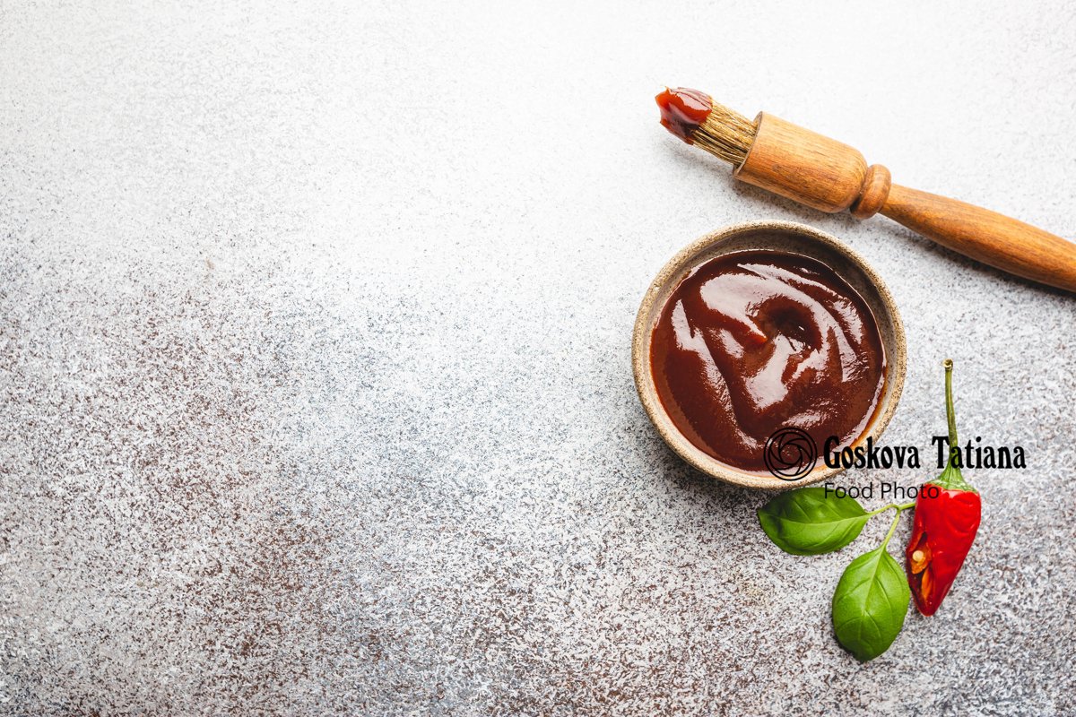 Photo of Barbecue sauce in a saucer with basting brush example image 1