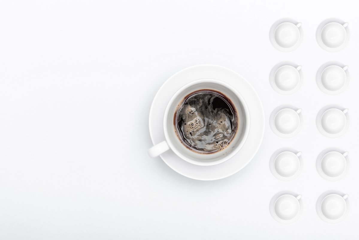 white cup of coffee on a saucer example image 1
