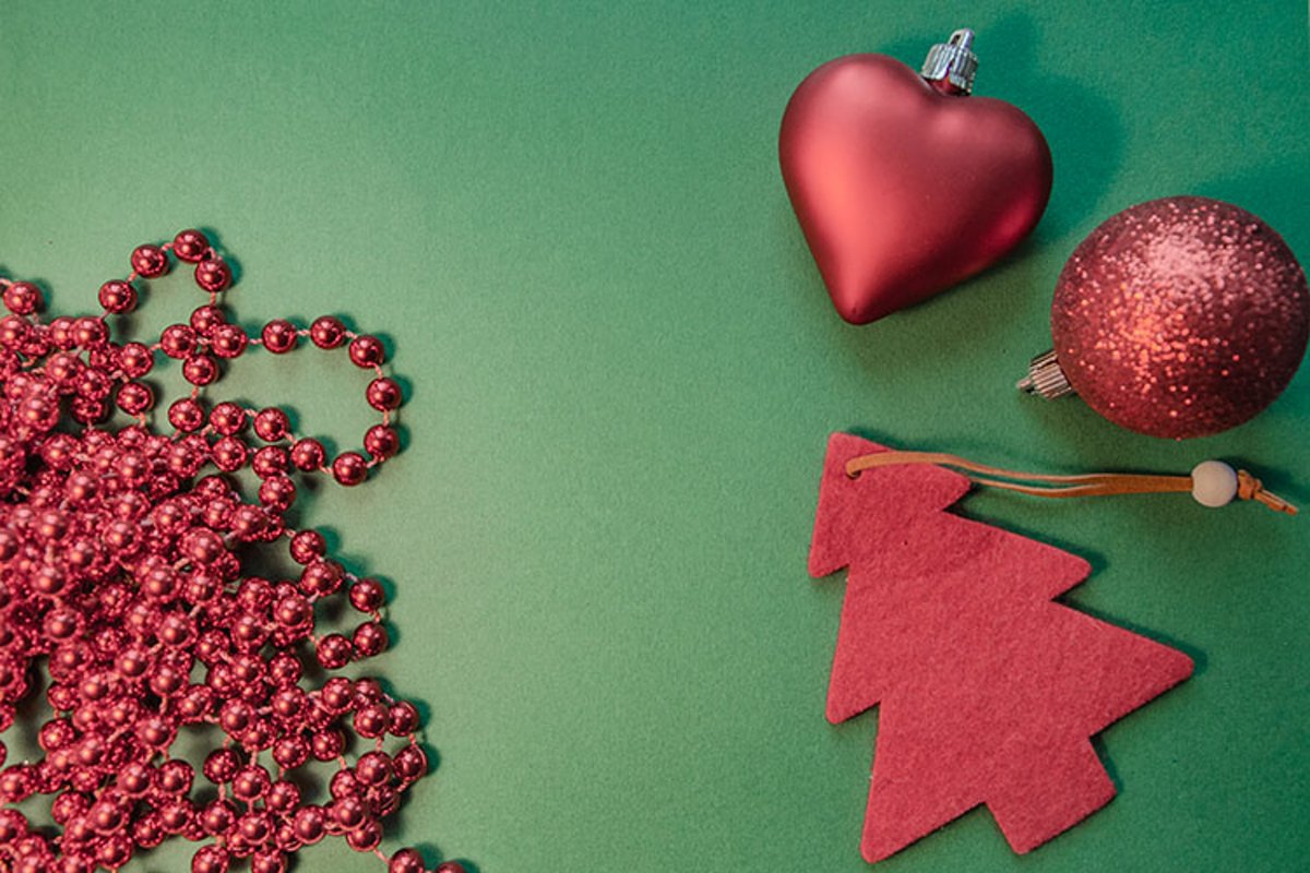 Red Christmas tree, beads, balls on a green background. example image 1