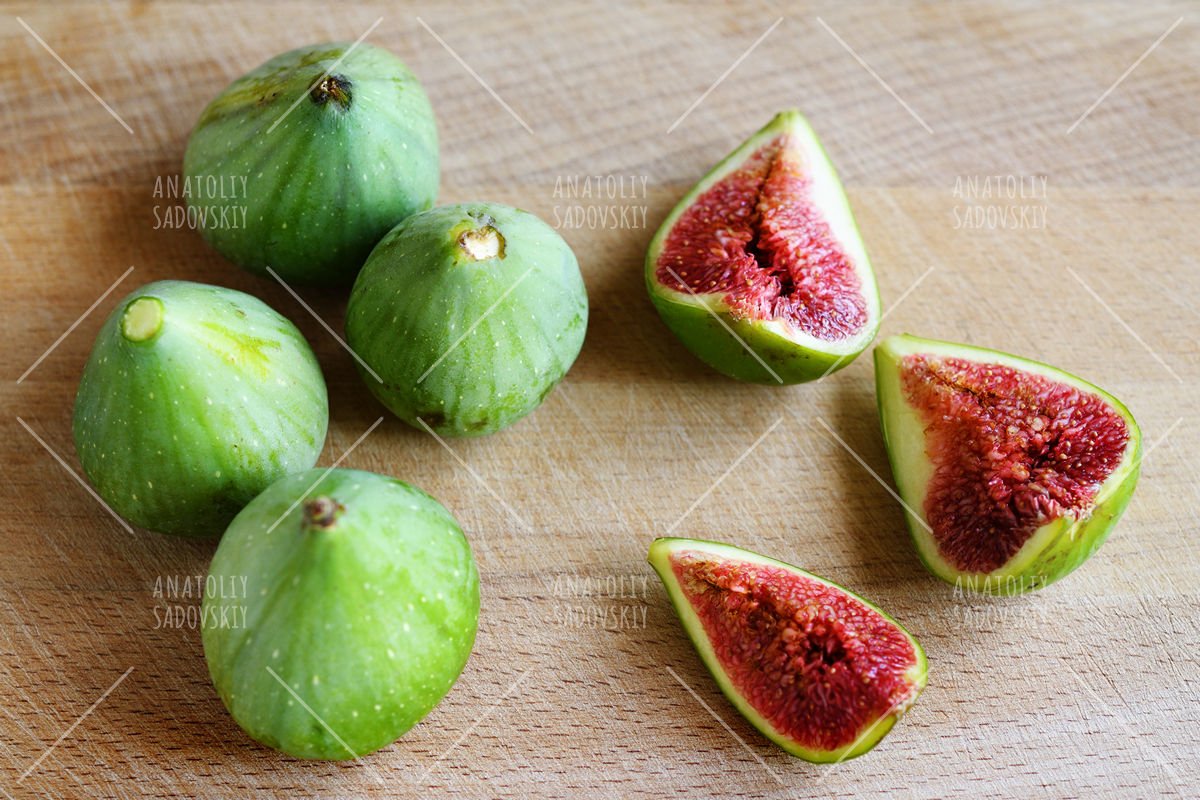 Fresh figs on wooden cutting board example image 1