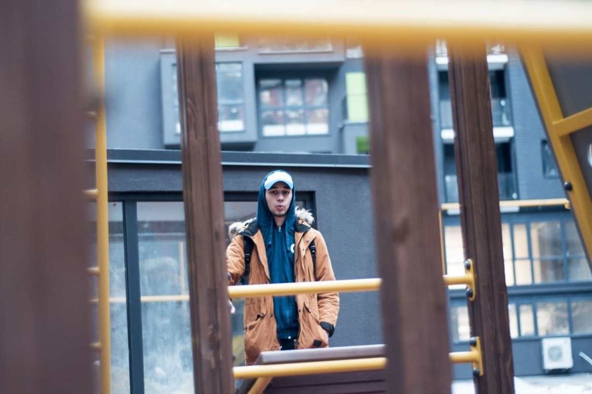 Young man walks in the city example image 1