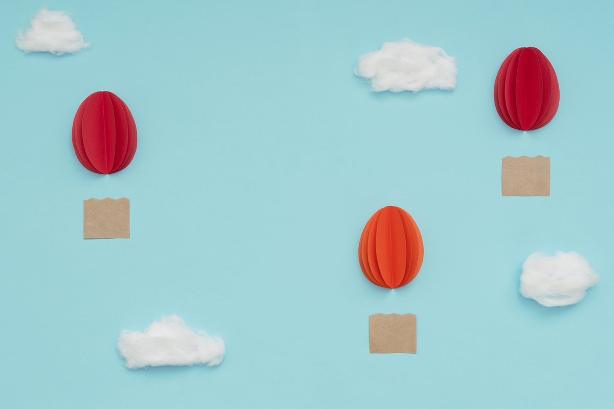 Easter egg hot air balloons made of paper on blue sky example image 1
