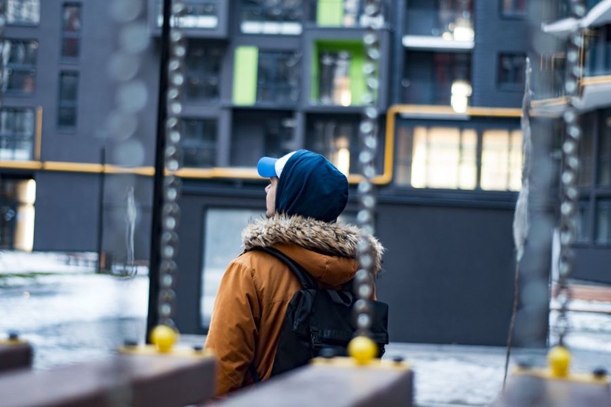 Young man walks in the city example image 1