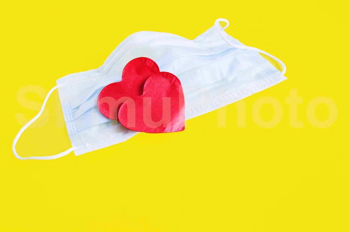 Blue cloth medical mask with two red heart on yellow example image 1