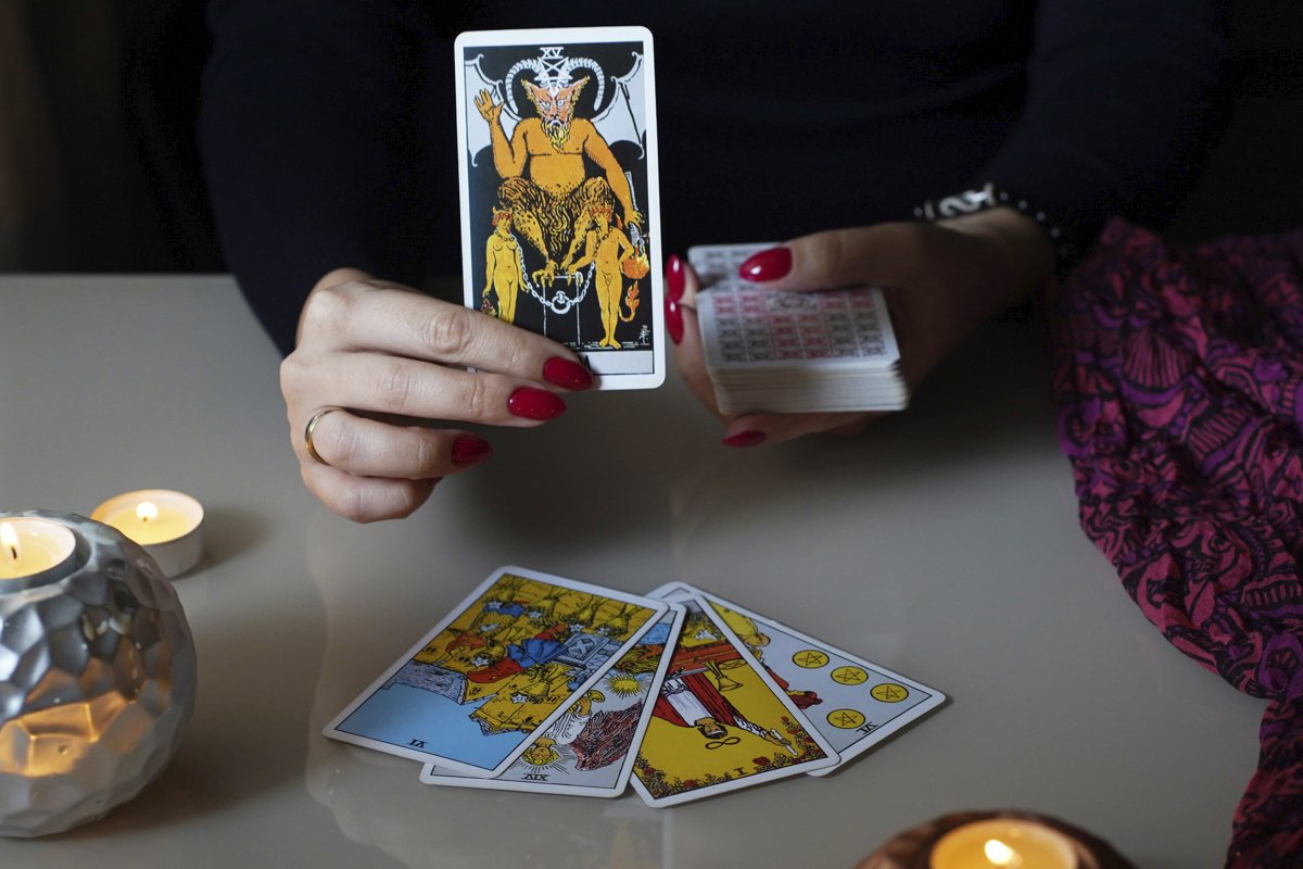 Tarot reader picking tarot cards. example image 1
