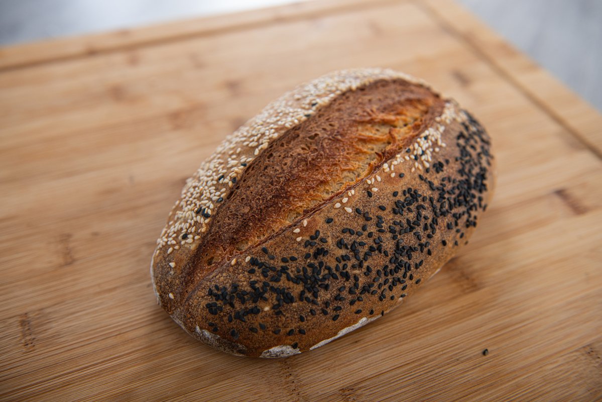 craft bread is sprinkled with white and black sesame seeds example image 1