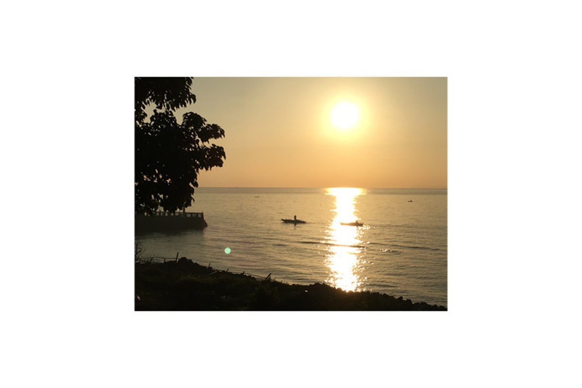 Photo of the sunset in the coastal town of Bacong example image 1