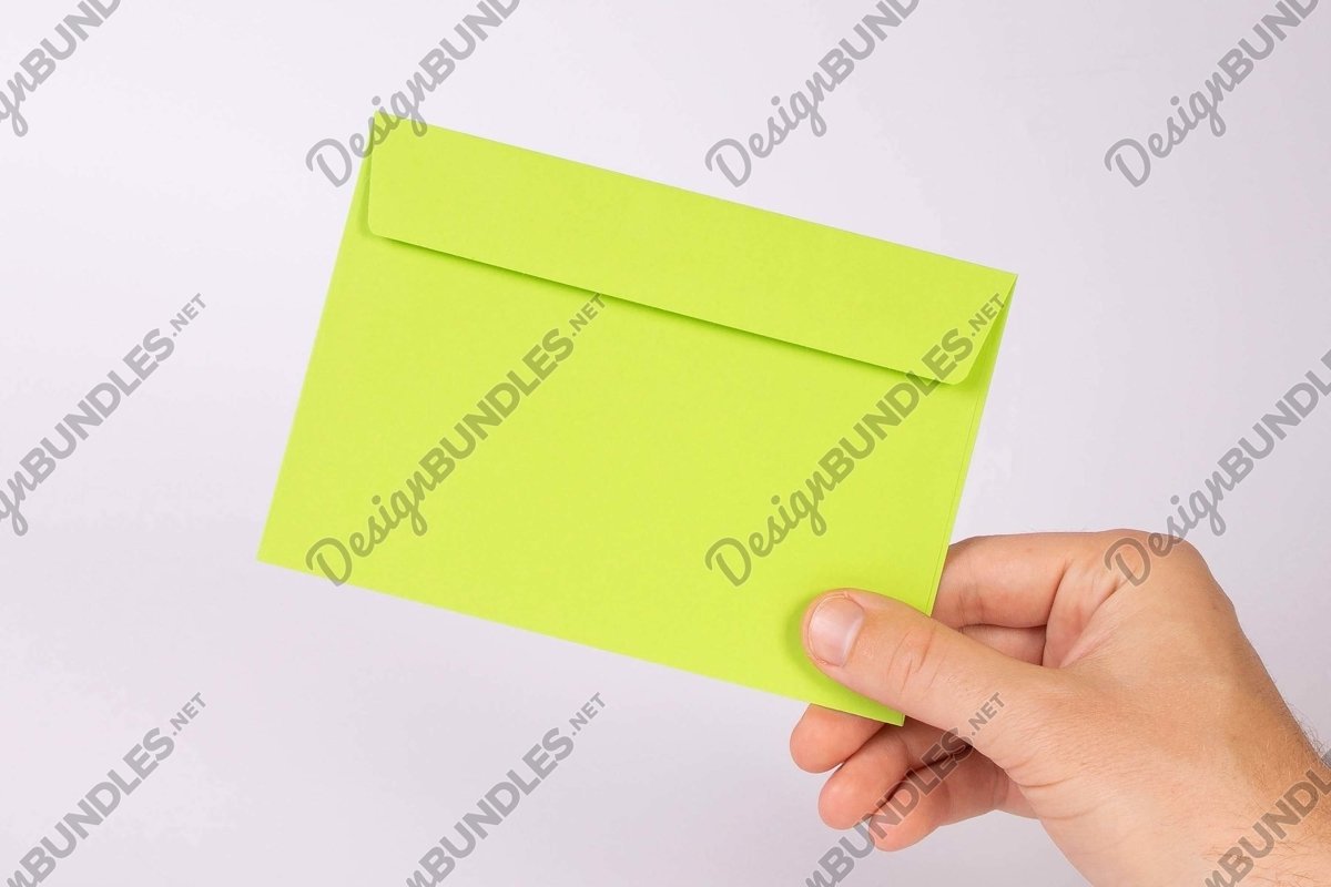 Stock Photo - Hand holding white blank house shape example image 1