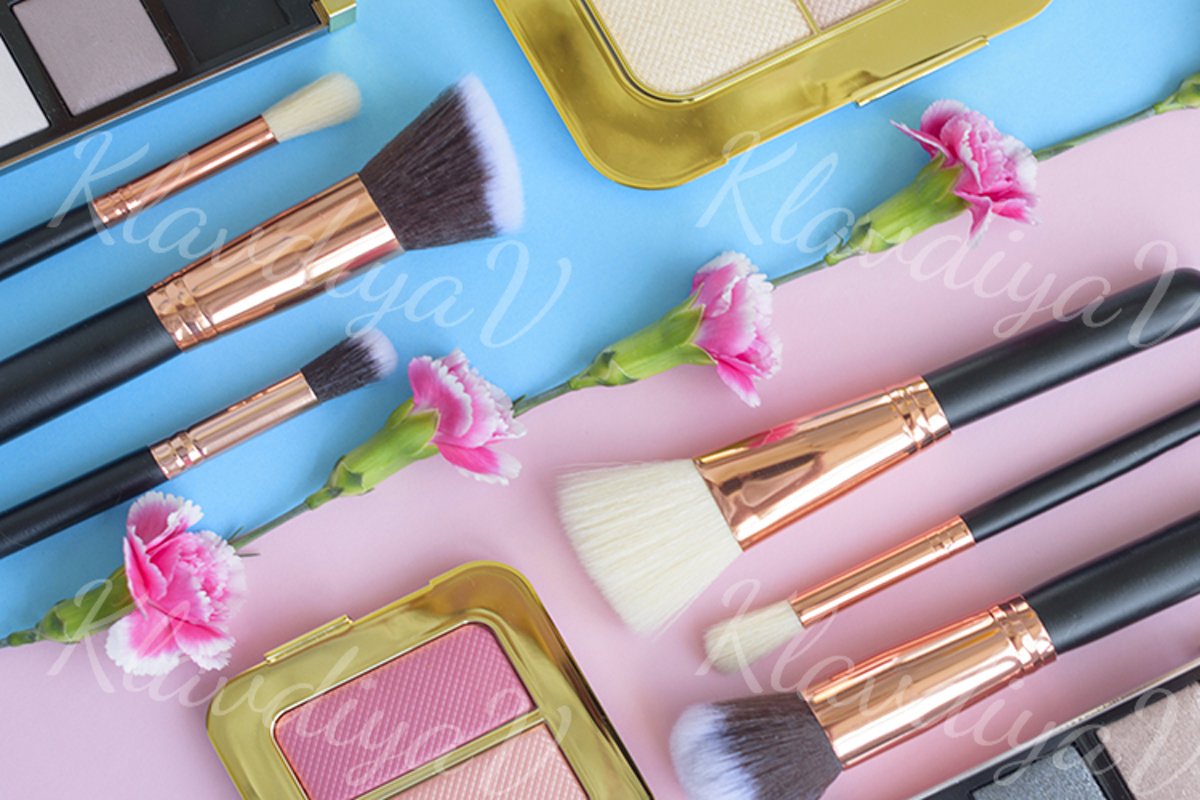 premium makeup brushes and blush on a colored background example image 1