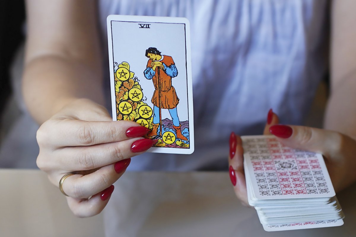 Tarot reader picking tarot cards. example image 1
