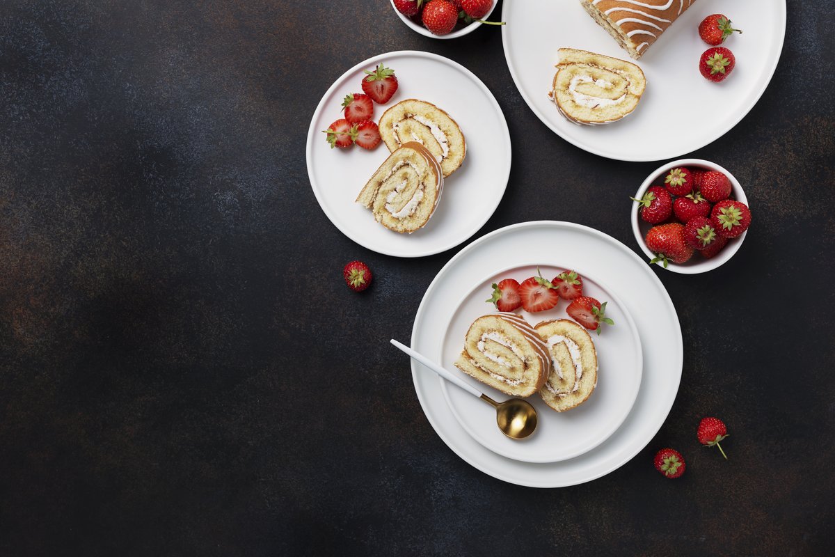 Sweet roll cake with white biscuit, cream and strawberry example image 1