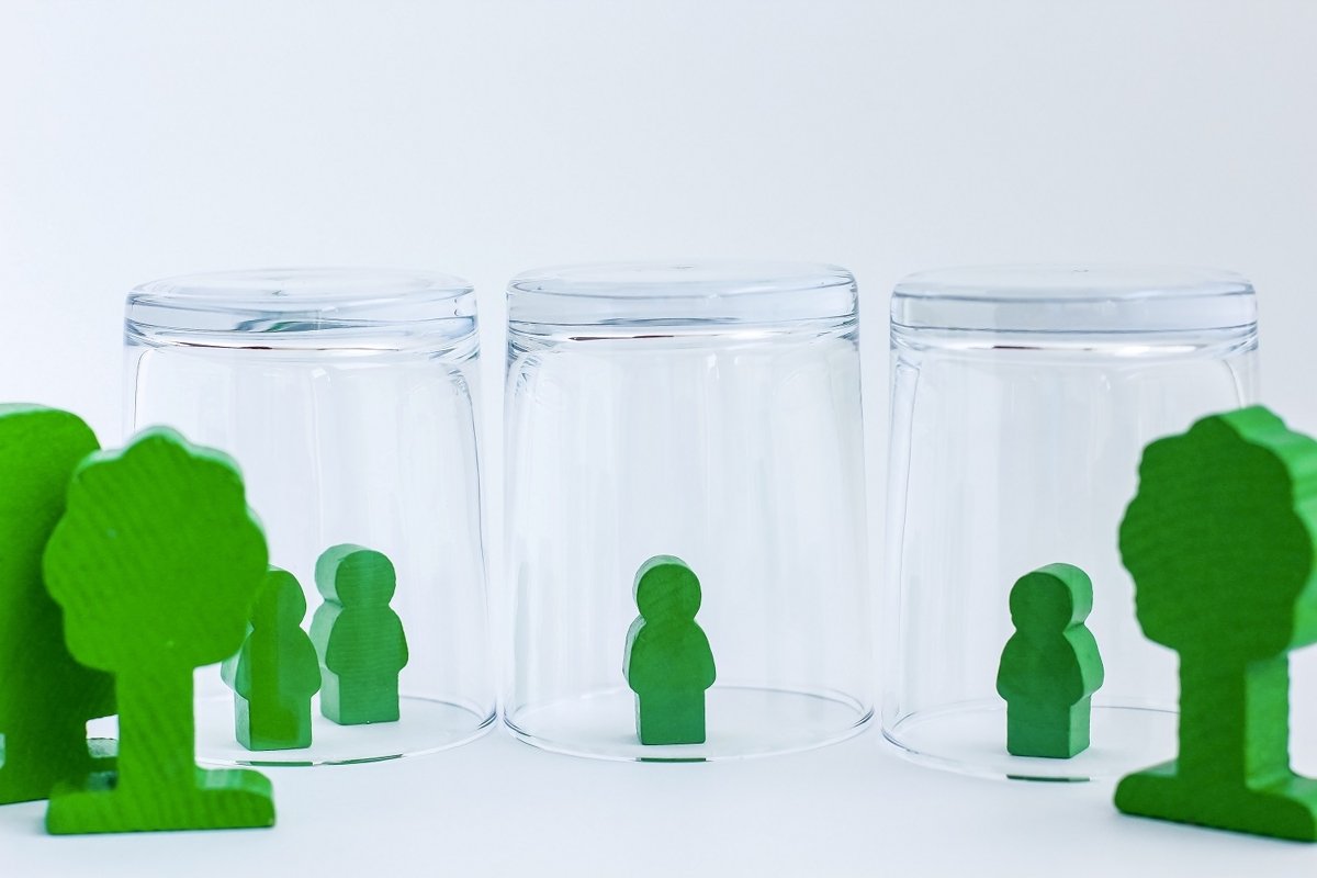 Toy wooden people under a glass. example image 1
