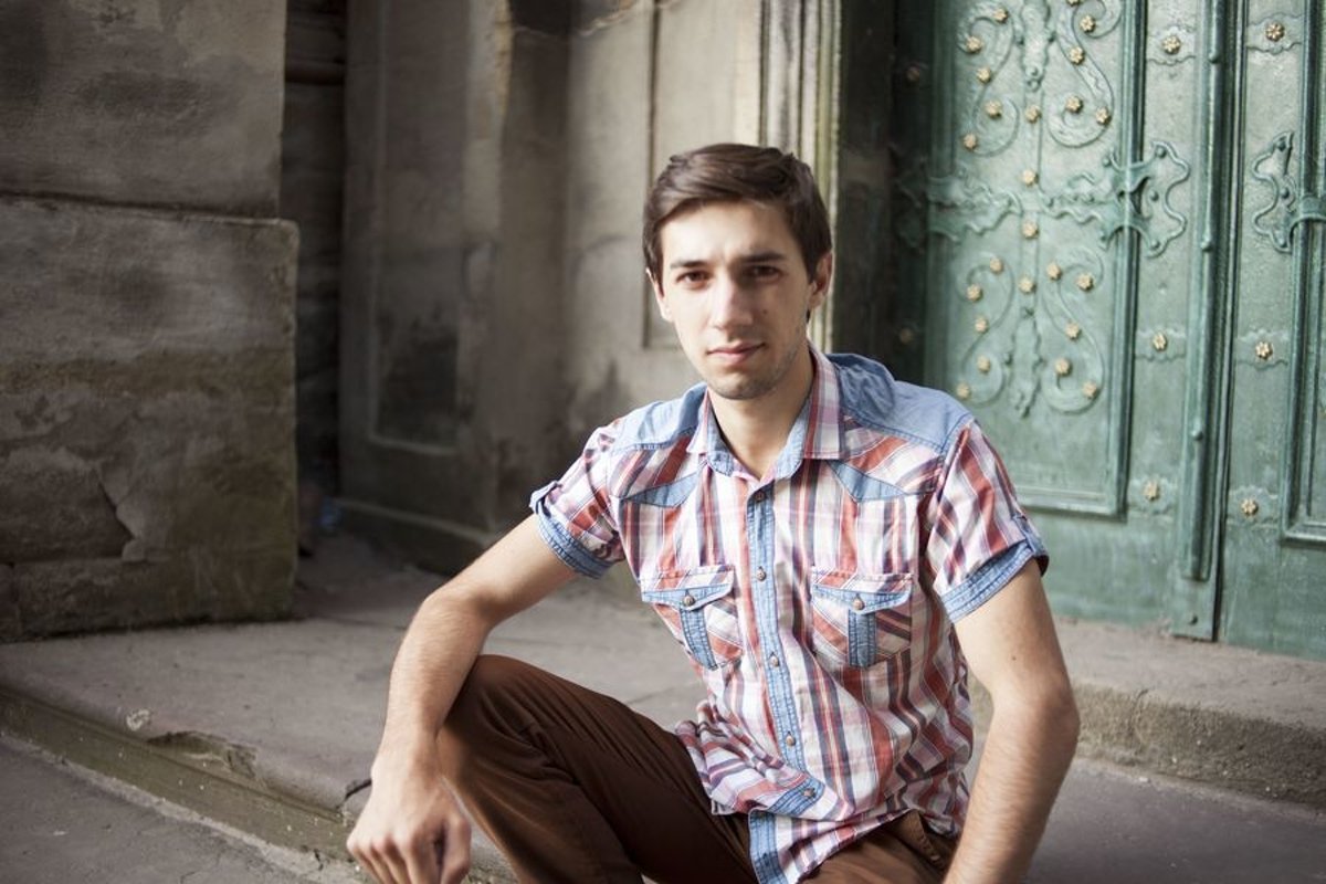 Young man walks in the city example image 1