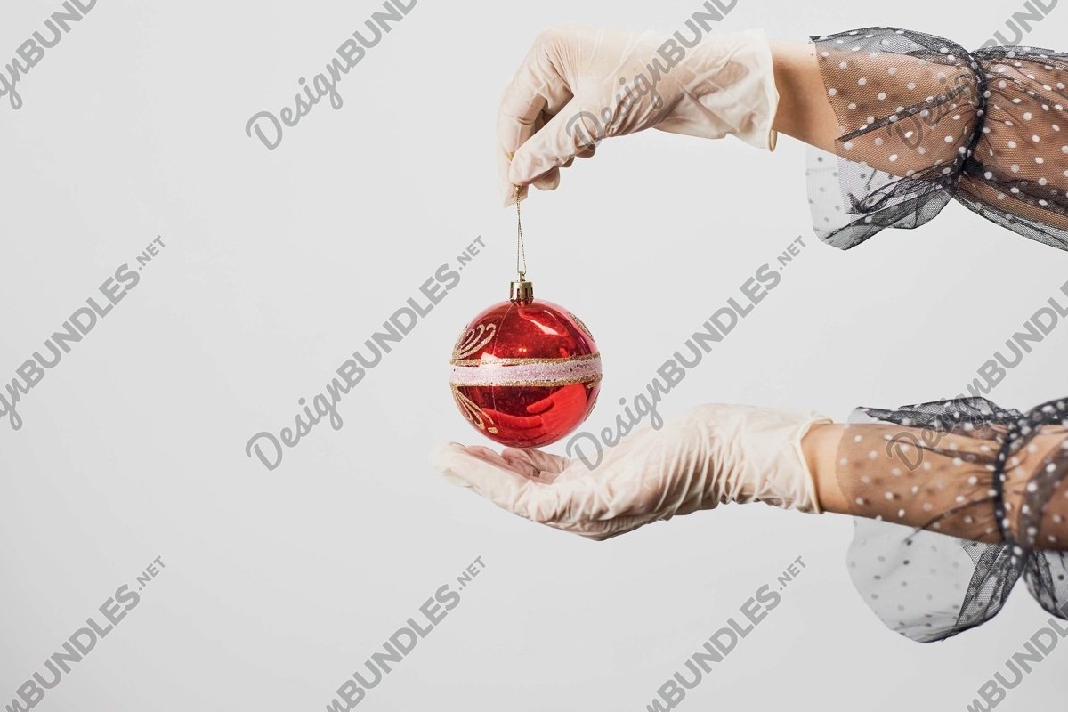 Stock Photo - Women Hand Holds Christmas jewelry example image 1