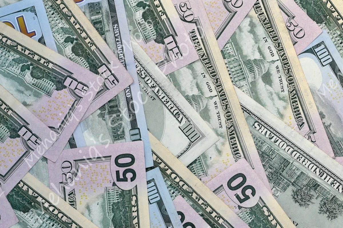 Many american dollar bills close up example image 1