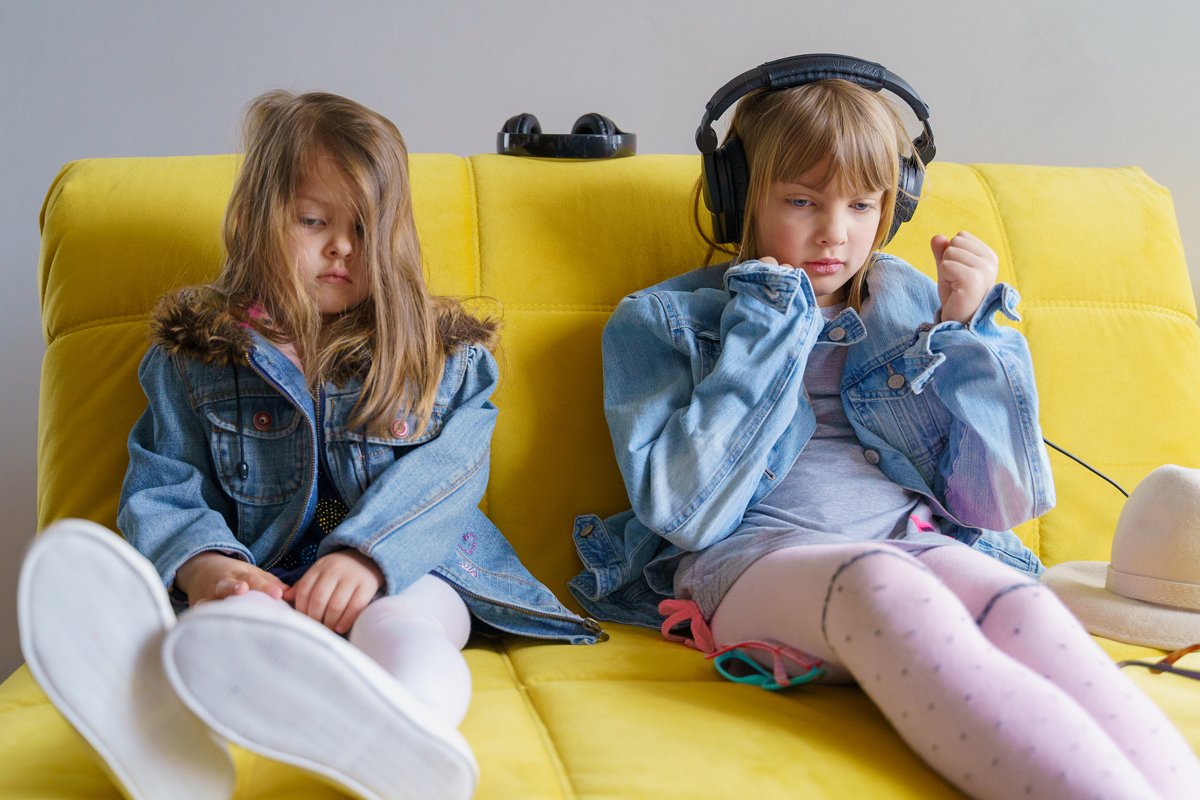 Hipster girls in denim jackets. Headphones, sunglasses, hat example image 1