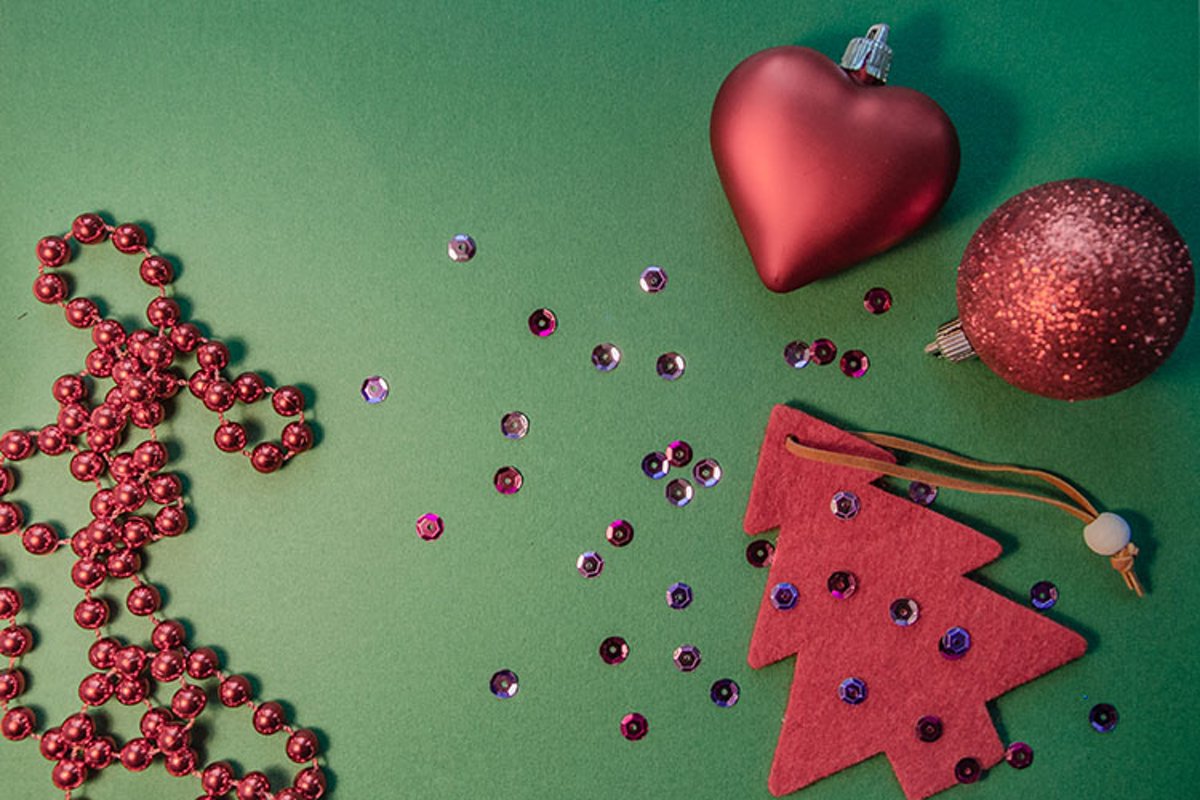 Red Christmas tree, beads, balls on a green background. example image 1