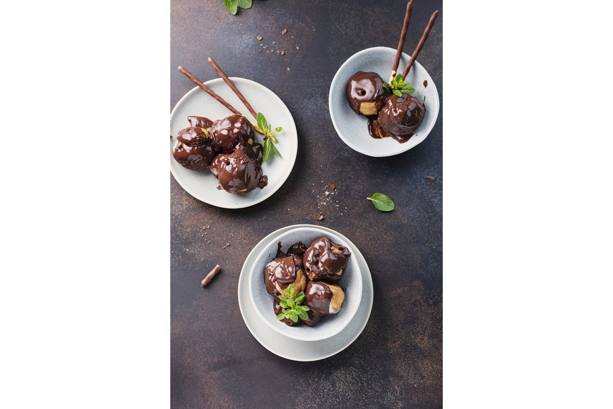 Traditional italian dessert profiteroles with chocolate example image 1
