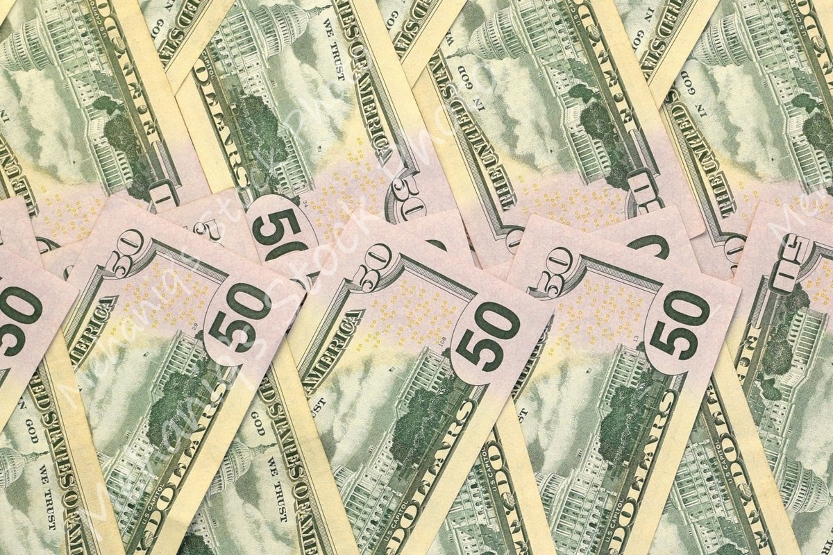 Many american dollar bills close up example image 1