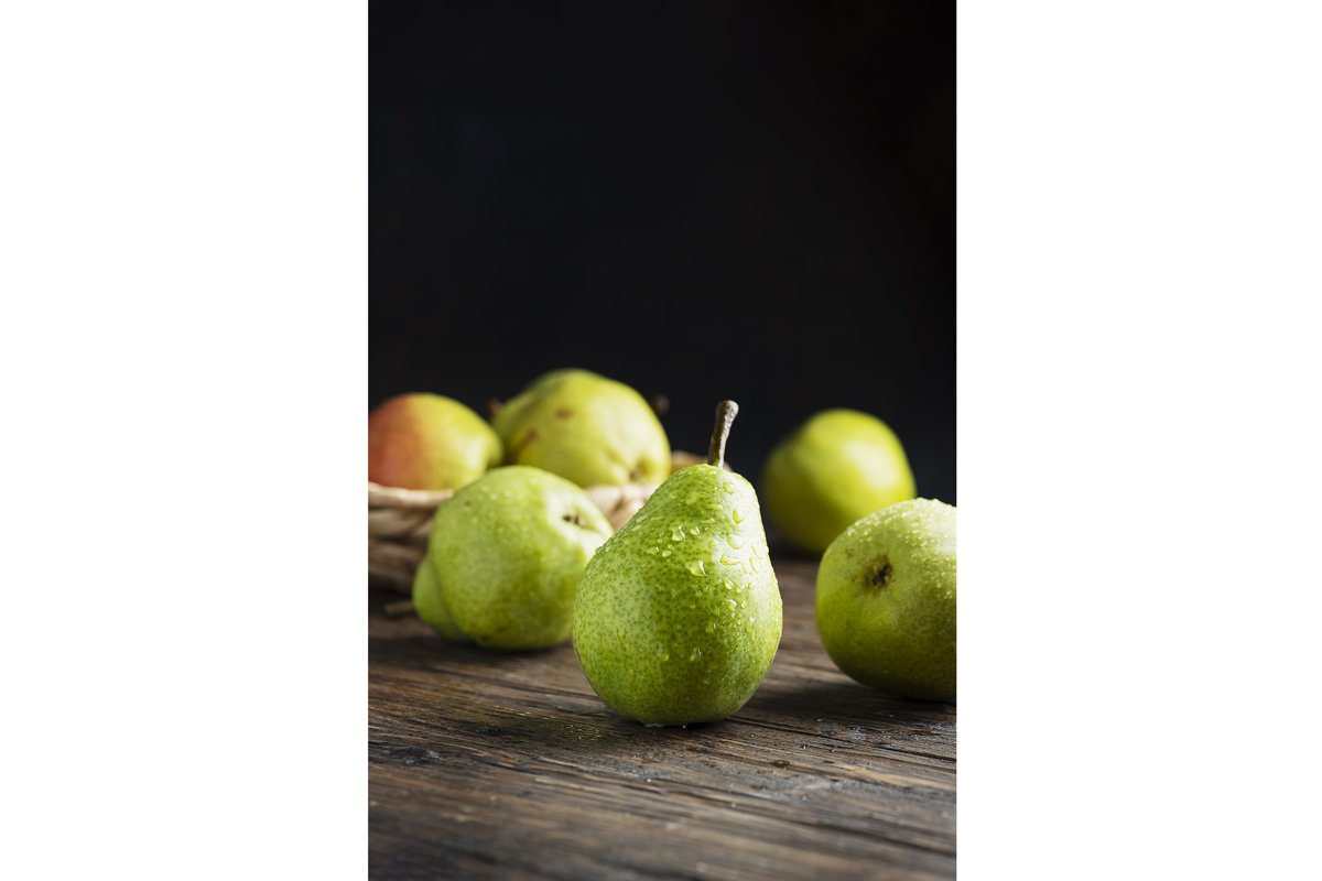 Sweet green pears on the wooden rustic table example image 1