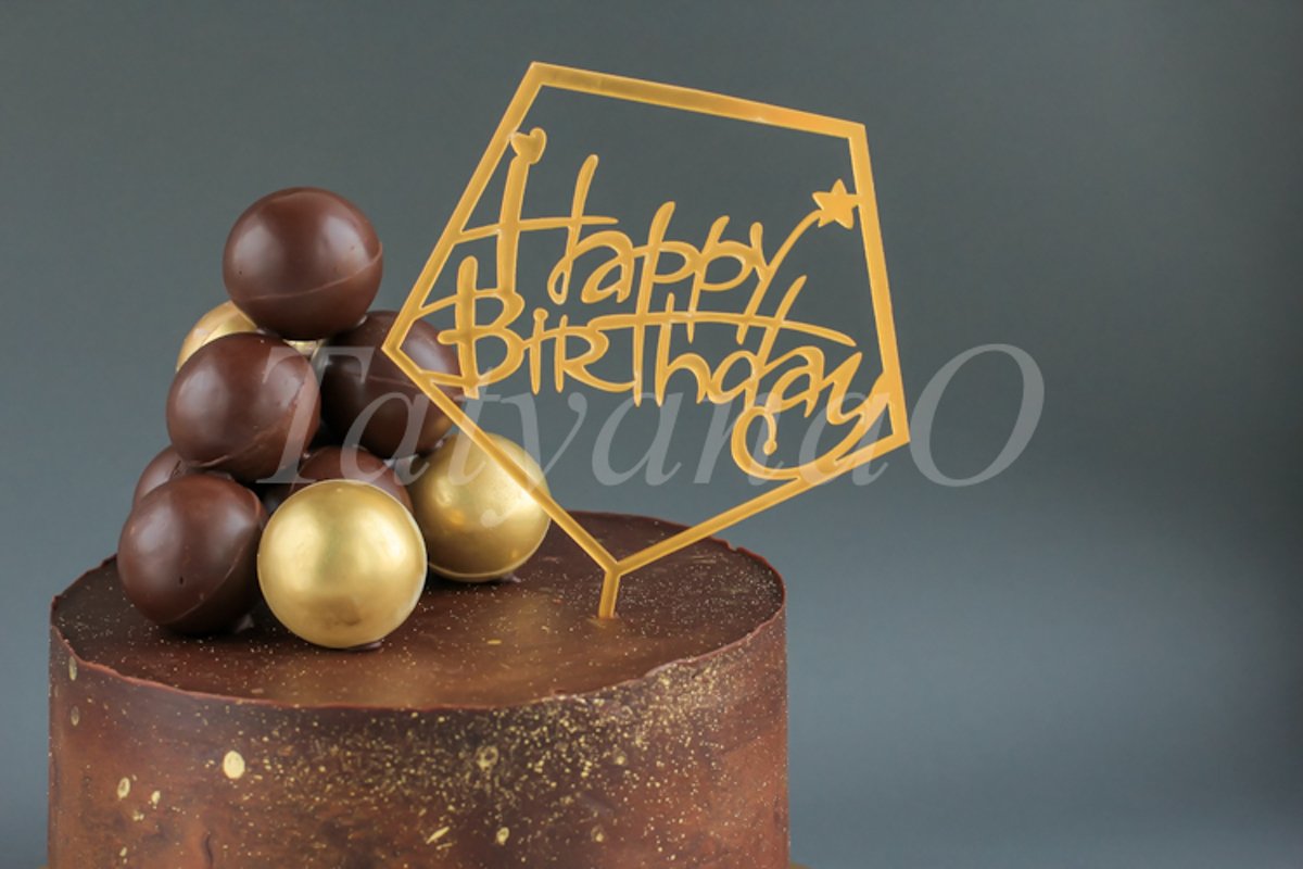 Chocolate birthday cake with gold decorations. example image 1