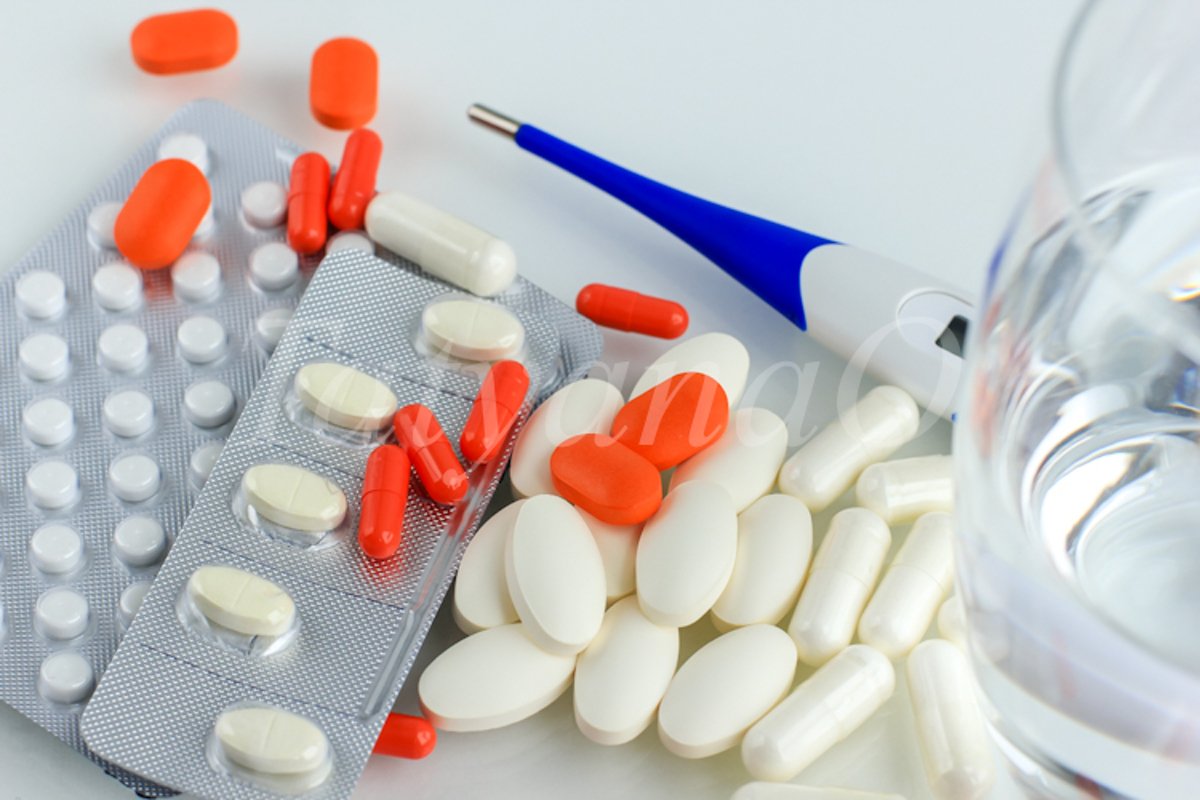 Multicolored pills, tablets against the virus, flu, disease example image 1