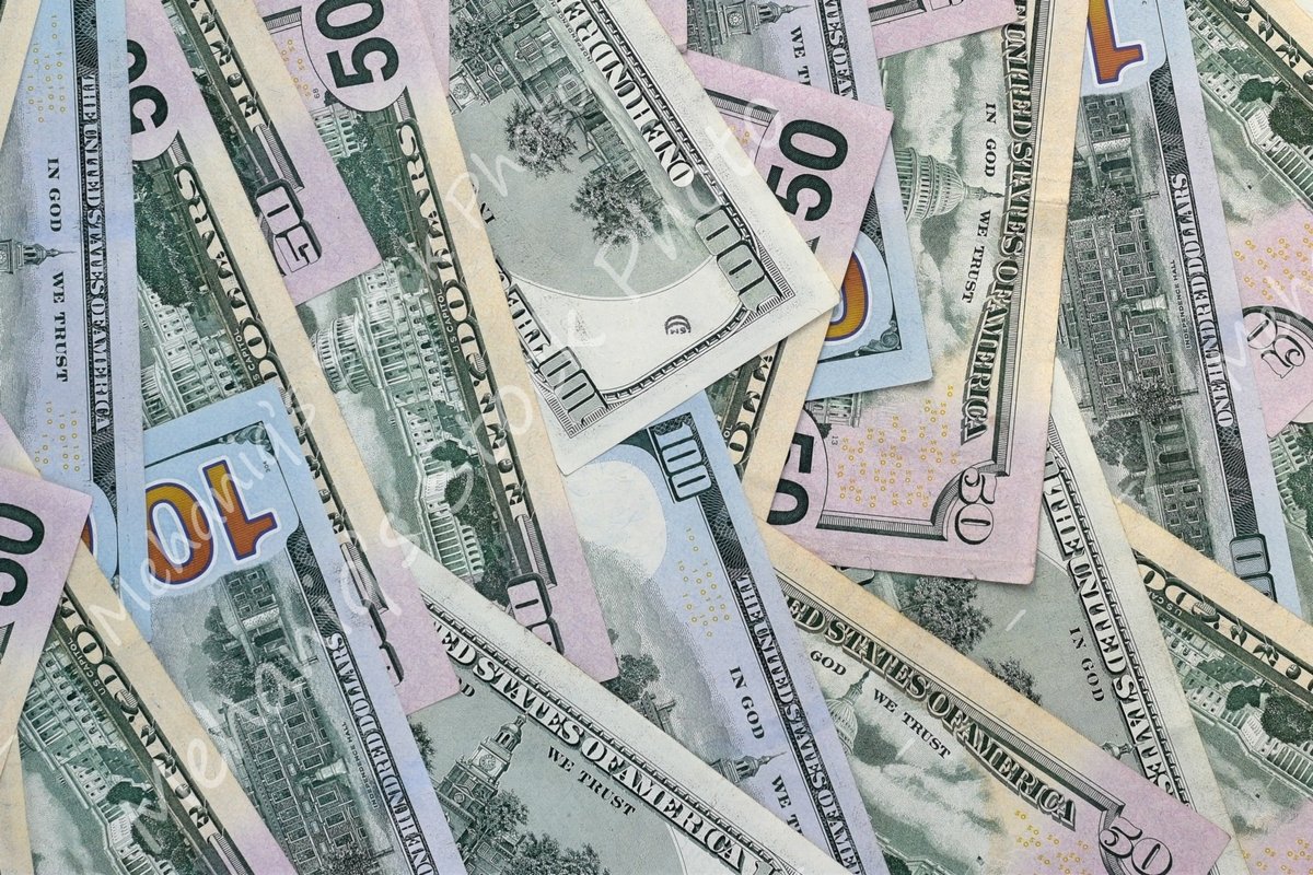 Many american dollar bills close up example image 1