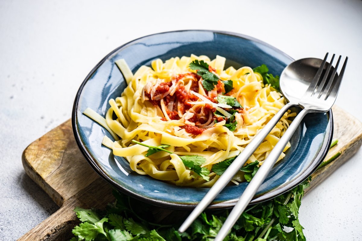 Traditional italian pasta with tomatoes and spinach example image 1