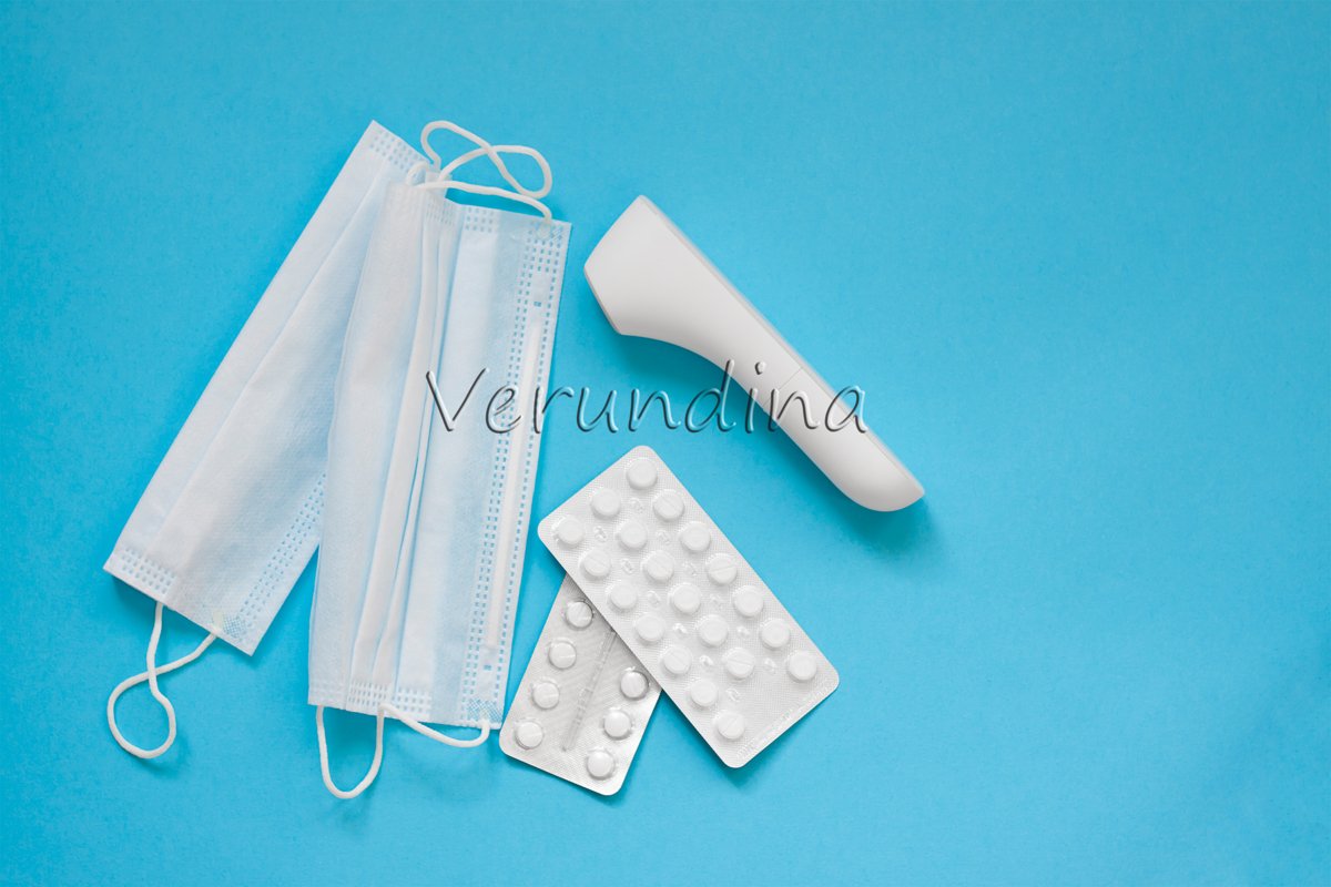 Face masks, thermometer on on a blue background example image 1